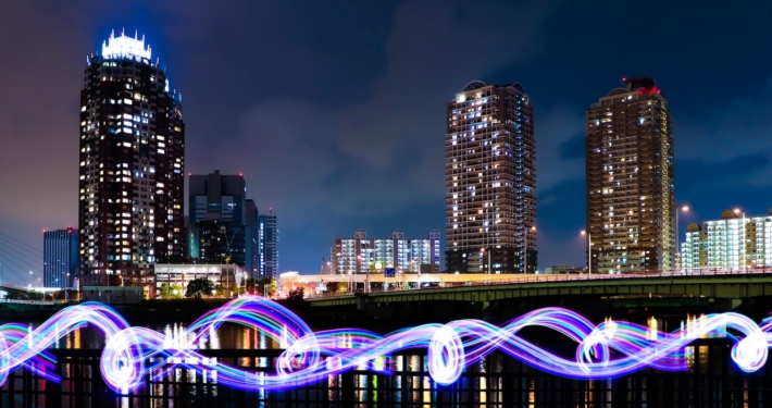 city skyline with lights turned on during night time