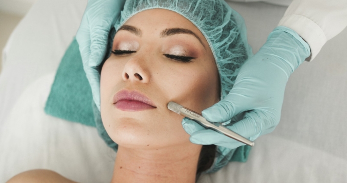 woman receiving facial skincare treatment